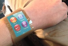 a person wearing a wristband with an app on it