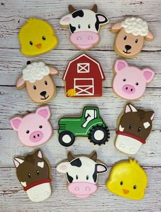 decorated cookies with farm animals and farm animals in the shape of sheep, cow, pig, tractor