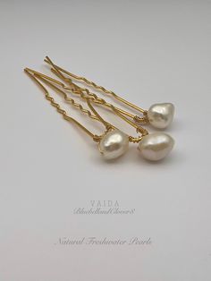 A beautiful freshwater pearl bridal hair pins handmade with delicate gold wire and luxury freshwater pearls.  Wear as a set of 3, a pair or alone to lend the prettiest pearly accent to wedding hair. A lovely choice for both brides and bridesmaids! Beautiful 7-8mm freshwater pearls hand wired onto a hair pin. The shape and shade may vary as these are a natural product. Available in silver and gold pins and sets of 3, 6 or 9 *If you would like these in a different pearl colour, please let me know as I also do customized orders* Pearls are associated with purity, integrity, and the loyalty of their wearer - which explains their continued popularity in wedding jewellery. Comes gift wrapped ready to give or to keep Pearl Hair Pin, Pearl Hair Pin Wedding, Bridal Hair Pins Pearl, Pearl Gifts, Pearl Pin, Pearl Hair Pins, Gold Pin, Pearl Bridal, Wedding Hair Pins