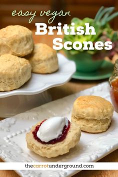 some biscuits and jam on plates with the words easy vegan british scones