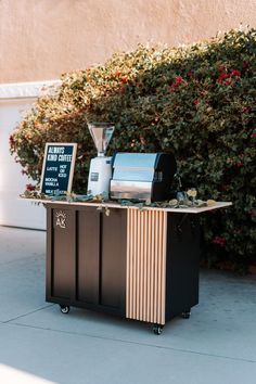 an outdoor coffee cart is set up outside