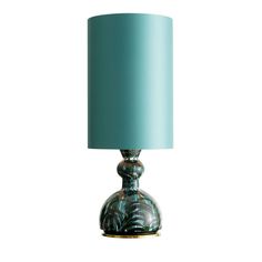 a green lamp with a blue shade on it