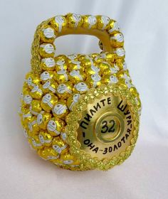 a gold and white candy bag with the number 32 on it's front side