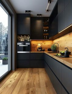 a kitchen with wooden floors and black cabinets, wood flooring, and an open window