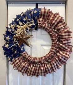 a patriotic wreath hanging on the front door