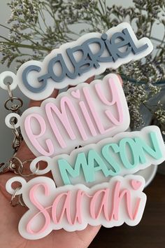 three keychains with the words'family mason smith'in different colors on them