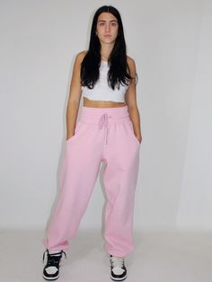 Our sculpting sweatpants feature a thick & adjustable waistband that gently sculpts the body, providing a snug yet breathable feel. Strategically crafted to enhance natural curves, designed with your confidence & comfort in mind. EXTRA FLATTERING, THICK SCULPTING ADJUSTABLE WAISTBAND DEEP SIDE POCKETS + BACK POCKETS ELASTIC BOTTOM, SLOUCHES PERFECTLY AT SHOE. Maria is 5 ft 7 and wearing size M *these sweats run large, if you do not want a super oversized fit, we recommend sizing down. Pair with Pink Sweatpants, Perfect Pink, Natural Curves, Adjustable Waistband, The Body, Infant Tees, Oversized Fits, Zip Ups, Sweatpants