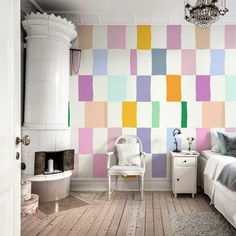 a bedroom decorated in pastel colors with a chandelier hanging from the ceiling