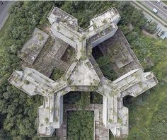 an aerial view of some buildings in the woods