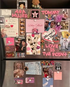 a refrigerator with magnets and pictures on the front, along with stickers that say love is the point