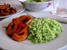 two plates with shrimp, rice and vegetables on them