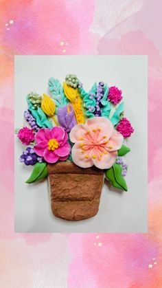 an arrangement of flowers in a clay pot on a pink and orange watercolor background