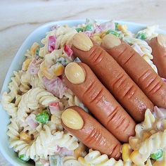 two hot dogs and pasta salad in a bowl