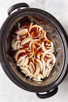 the food is being cooked in the slow cooker