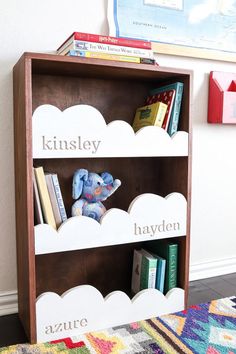 a book shelf with books and stuffed animals on it