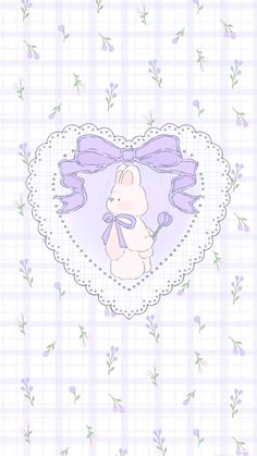 a heart shaped frame with a teddy bear in the center on a checkered background