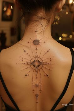 the back of a woman's neck is shown with stars and planets on it