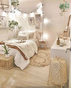 a bedroom with white walls and wooden flooring is decorated in neutral tones, including wicker baskets