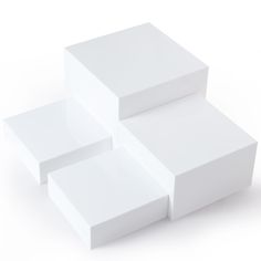 three white boxes stacked on top of each other in the shape of rectangles