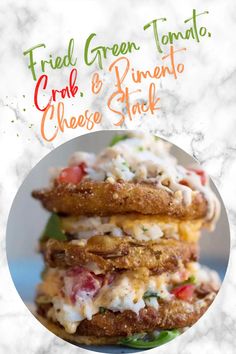 fried green tomato, crab and rindo cheese stack on a plate with text overlay