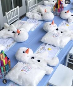 stuffed animals are laid out on the table for children to draw and paint with crayons