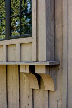 a window on the side of a wooden building