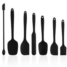 black kitchen utensils lined up in a row