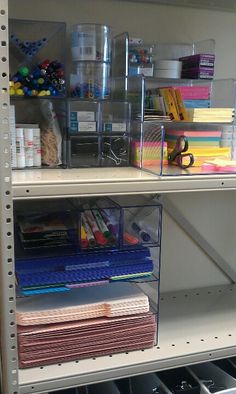 the shelves are filled with many different types of crafting supplies, including pens and paper