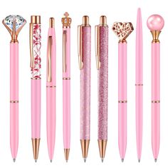 various types of pink pens with gold trimmings and diamond in the top left corner