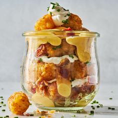 a glass jar filled with food sitting on top of a table