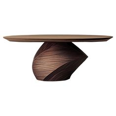 a wooden table with a circular top and wavy design on the base, against a white background