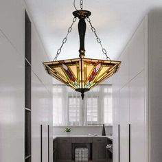 a light fixture hanging from the ceiling in a hallway