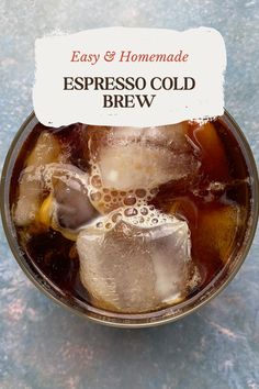 an iced drink in a glass with ice cubes on the side and a label that says easy & homemade espresso cold brew