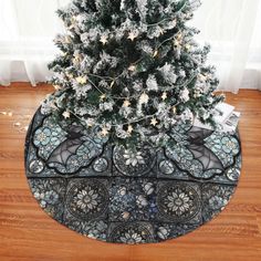 a decorated christmas tree stand in front of a window