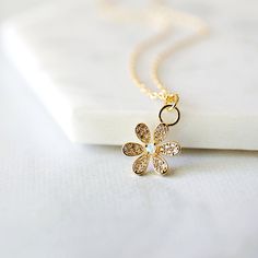 "Beautiful and lovely tiny gold flower necklace. Made of cubic and tiny opal stone gold flower with skinny gold chain. Soft and warm-looking dainty necklace is good for yourself or gift ! Your necklace will ship in a rudiana gift box. * Gold plated over brass * Opal stone / CZ * Length available 15\"-20\" * Flower pendant 3/8\" * Creation Time: 1 - 3 days ♥ See more Rudiana Accessories Rudiana.etsy.com" Delicate Tiny Gold Jewelry, Delicate Flower Shaped Necklace For Bridesmaid Gift, Gold Flower Charm Pendant Necklace, Delicate Necklace With Flower Charm, Gold Pendant Flower Necklace With Flower Charm, Delicate Gold Pendant Flower Necklace, Gold Pendant Necklace With Flower Charm, Dainty Flower Necklace With Flower Charm, Delicate Flower Pendant Necklace