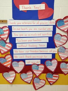 an american flag bulletin board with hearts and thank you written on the front, in red white and blue colors