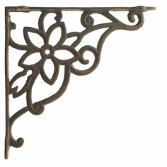 an ornate iron shelf bracket on a white background