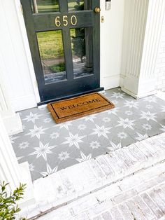 a welcome mat is on the front door