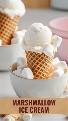 two bowls filled with marshmallow ice cream on top of a white countertop