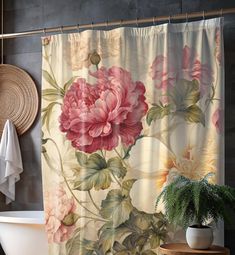 a bath tub sitting next to a shower curtain with flowers on it in a bathroom