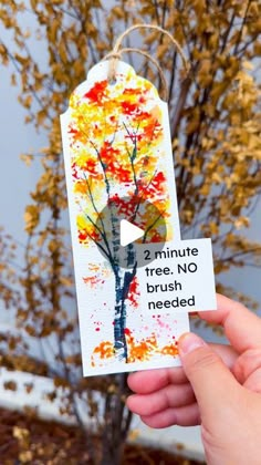 someone is holding up a card with an image of a tree and the words, no brush needed