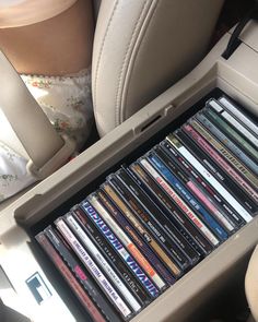 a bunch of cds in the back seat of a car