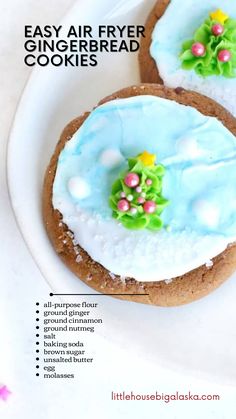 two cookies decorated with icing and flowers are on a white plate, next to the words easy air fryer gingerbread cookies