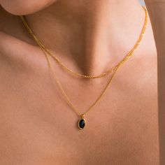 L A Y E R E D ∙ O N Y X ∙ N E C K L A C E  Elevate your style with our Duo Layered Onyx Necklace, featuring a Figaro Chain paired with an oval Onyx Pendant on a Cable Chain,  seamlessly connected at the back. This captivating piece exudes timeless charm and modern sophistication, perfect for adding a touch of elegance to any outfit! * Material: High Quality 925 Solid Sterling Silver * Finish: 18K Gold ∙ Sterling Silver * Featuring a connected Layered Necklace Set with ~15in Figaro Chain and a ~1 Black Double Chain Necklace As Gift, Black Double Chain Necklace For Gift, Black Oval Link Jewelry For Gifts, Modern Black Jewelry With Double Chain, Black Jewelry With Oval Link Cable Chain, Black Oval Link Cable Chain Jewelry, Gold Onyx Gemstone Necklace, Gold Oval Necklace With Black Enamel, Gold Necklace With Black Enamel Oval Pendant