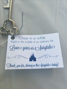 a keychain with a note attached to it that says, once in a while right in the middle of an ordinary life love gives us a fairy tale