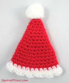 a crocheted red and white santa hat