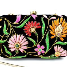 Turn heads wearing this colorful floral embroidered black velvet evening clutch bag. Be bright and bold! This exclusive design is expertly hand embroidered by master zardozi artisans. Each petal and leaf is outlined with glittery metallic gold threads and embellished with genuine semi precious stones, including garnets, turquoise, carnelian and onyx. Shop sustainably - own a handbag of exceptional quality that you will keep forever and pass down to the next generation. View more exclusive embroi Multicolor Embroidered Clutch For Evening, Embroidered Multicolor Clutch For Evening, Luxury Black Clutch For Festive Occasions, Evening Clutch With Multicolor Embroidery And Handwork, Multicolor Evening Clutch With Zari Work, Evening Multicolor Clutch With Zari Work, Designer Embroidered Evening Bag, Luxury Floral Embroidered Evening Clutch, Floral Embroidered Clutch For Party And Festivals