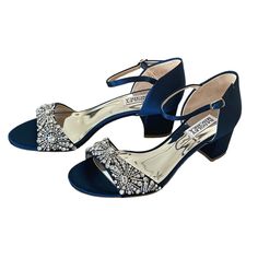 a pair of women's shoes with bows on the toes and heels in blue satin