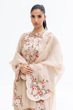 This intricately crafted ensemble is the embodiment of modern allure. An organza shirt is crafted with artful floral embroidery in hues of pink on a beige canvas. It comes with a rawsilk shalwar with floral embroidered motifs and an embroidered organza dupatta finishes the look. Sania Maskatiya, Organza Shirt, Embroidered Motifs, Embroidered Organza, Embroidery Flowers Pattern, Designer Name, Website Features, Organza Dupatta, Silk Dupatta