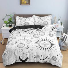 a white bed with black and white designs on it